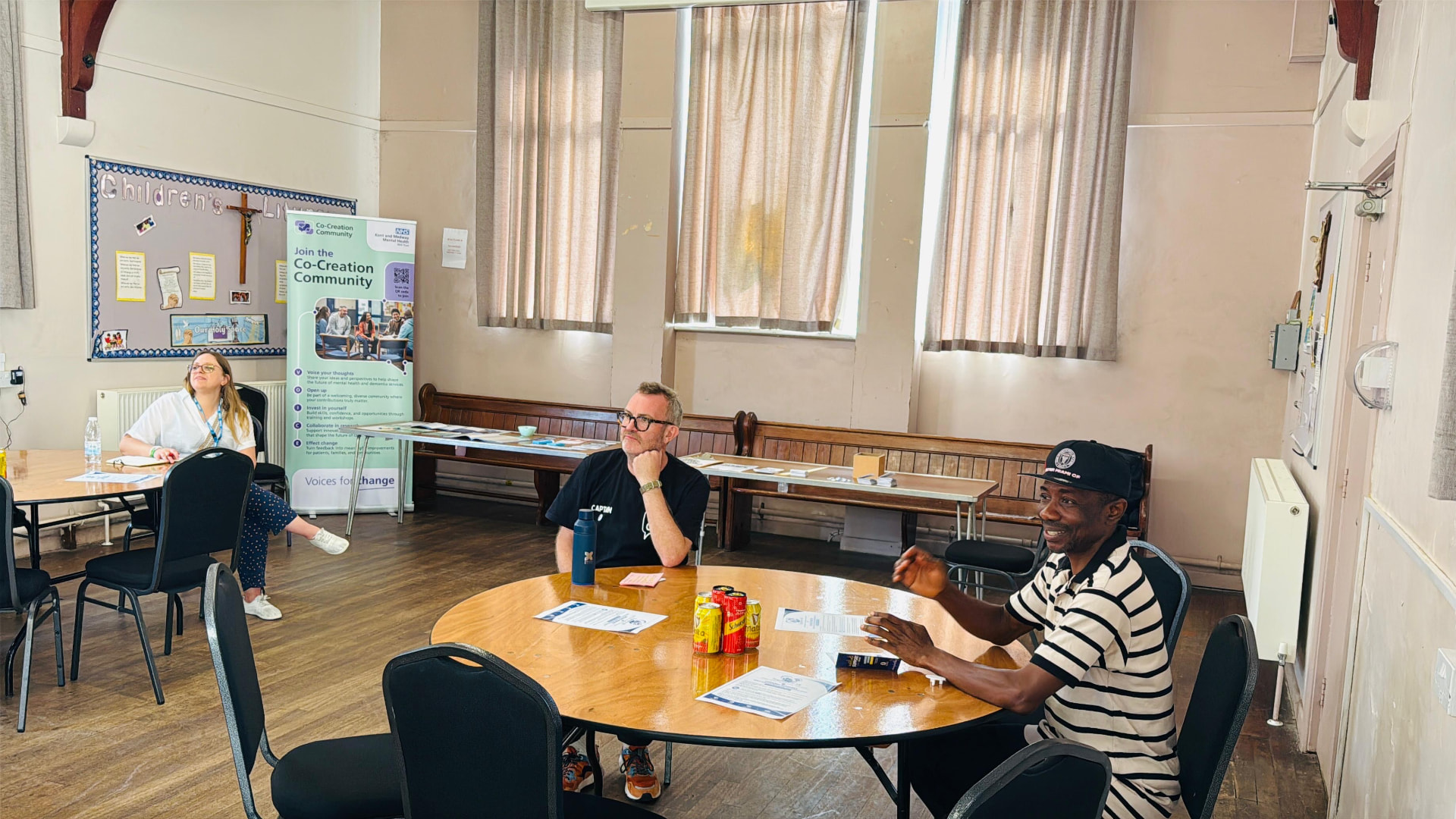 Residents seated at a table during a Co-Creation Community NHS session